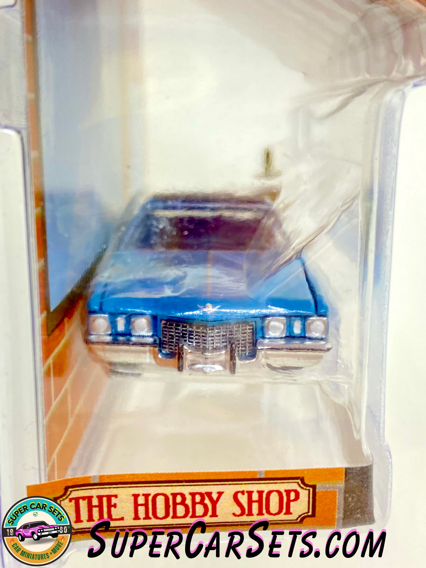 1972 Cadillac Coupe deVille with Vintage Gas Pump - The Hobby Shop Series 13 made by Greenlight Collectibles